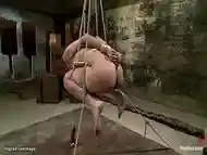 Slave in rope suspension throat fucked