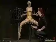 Slave in yellow latex vibrated