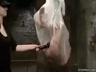 Asian wrapped in plastic and hung