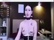 BDSM babe puts on nipple clamps