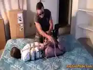 Very tight rope bondage and tape gag